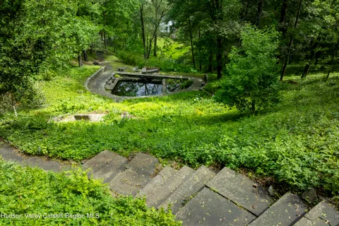 a view of a backyard with chairs