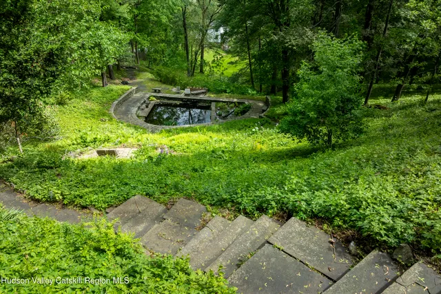 a view of a backyard with chairs