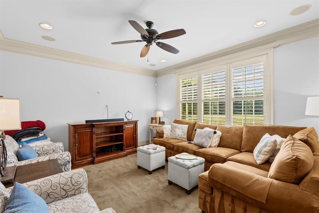 7787 Sutter Road Greensboro, NC 27455 - Photo 19 of 50 Den is off kitchen, a perfect space for cozying up in the evenings