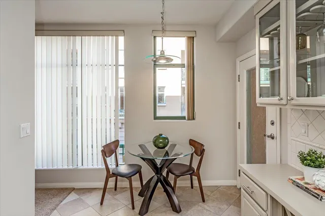 a view of a dining room with furniture and window