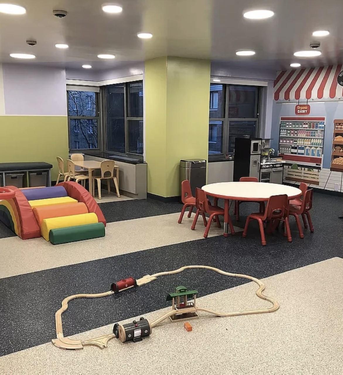 360 East 72nd Street, Unit C2205 Manhattan, NY 10021 - Photo 13 of 16 a room with gym equipment and a table