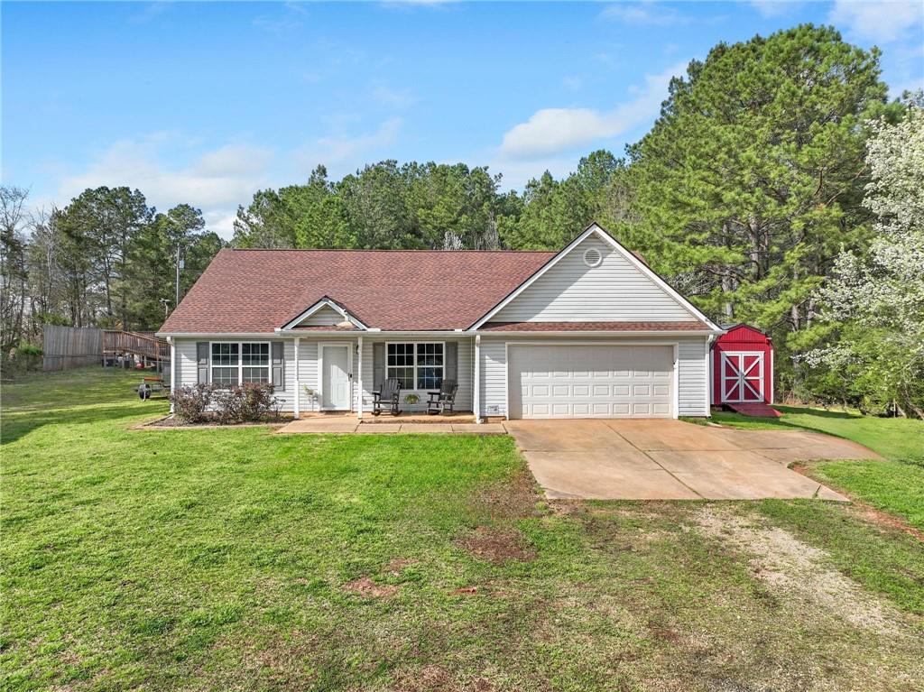 a front view of a house with garden