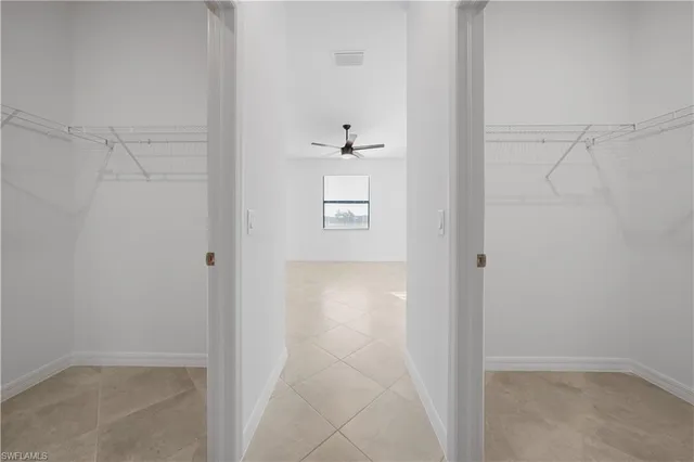 a kitchen with stainless steel appliances granite countertop a sink dishwasher stove and microwave with wooden cabinets