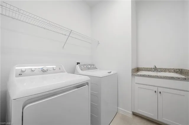 a bathroom with a granite countertop sink a toilet and bathtub