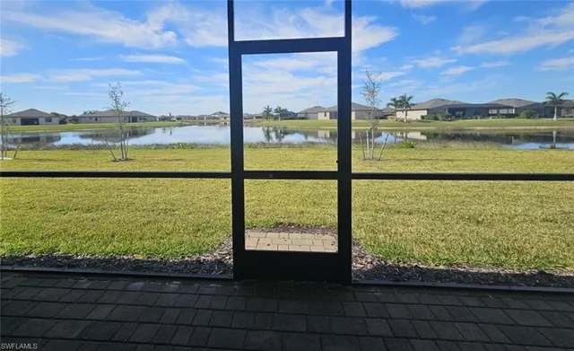 a view of room with refrigerator and window