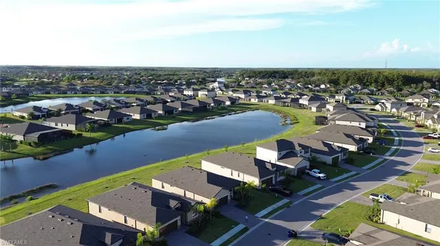 a aerial view of a house with a lake view