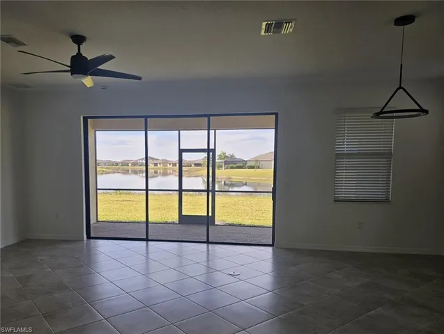 a view of an empty room and window