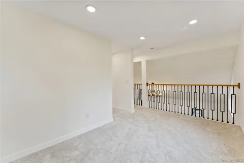a view of a livingroom with stairs