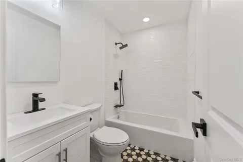 a bathroom with a sink a toilet and a bathtub