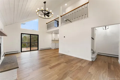 a view of an entryway with wooden floor