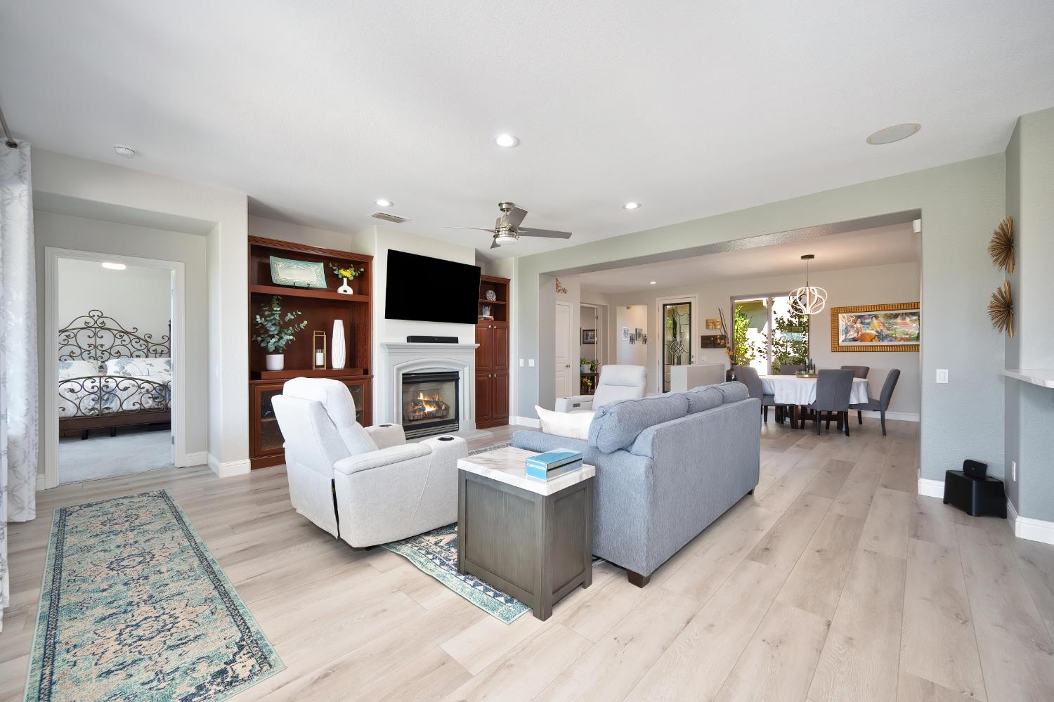 561 Rustic Ranch Lane Lincoln, CA 95648 - Photo 9 of 48 View of living room and formal dining, with peak into Primary bedroom