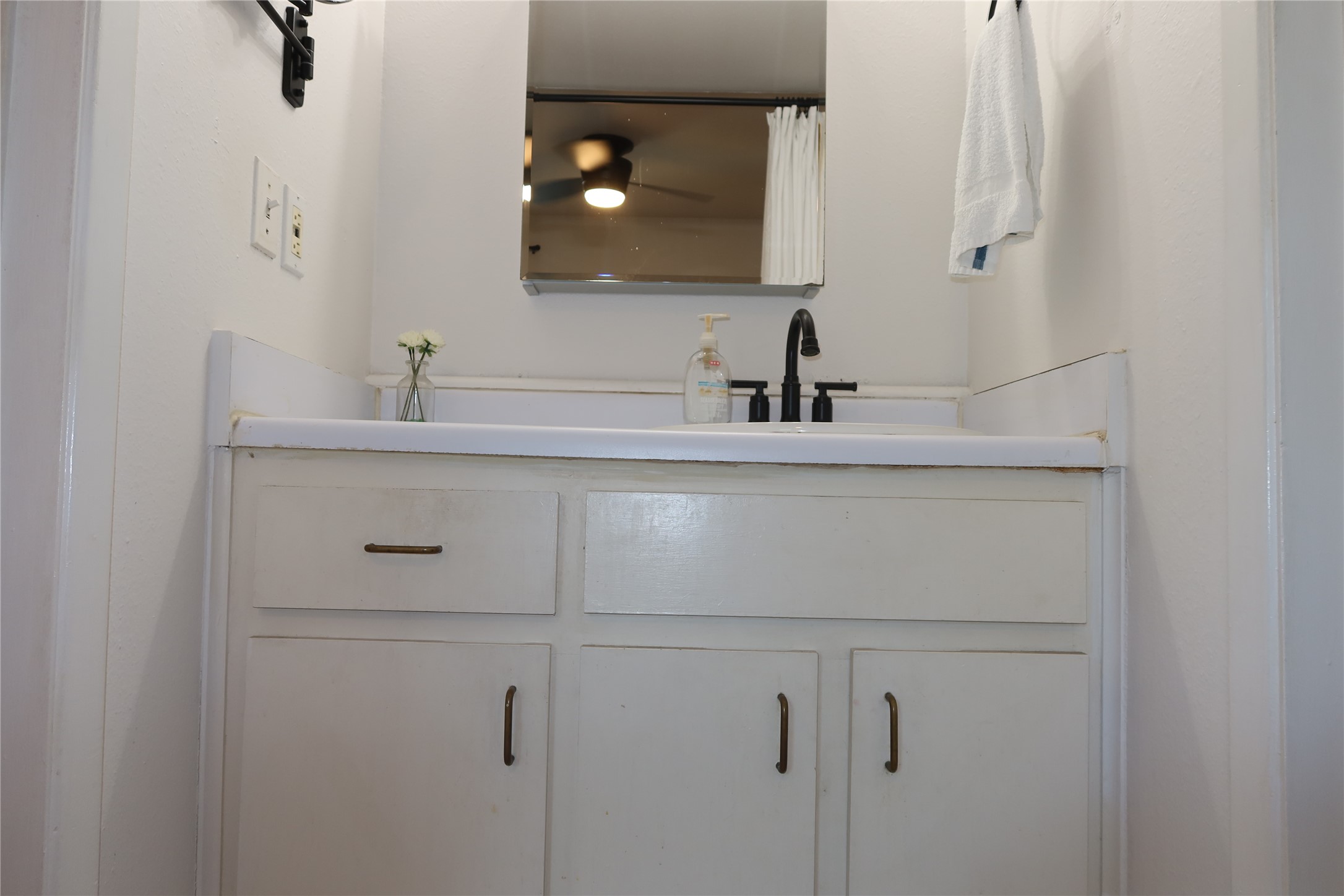 3400 Speedway, Unit 104 Austin, TX 78705 - Photo 20 of 23 Bathroom with vanity and a ceiling fan