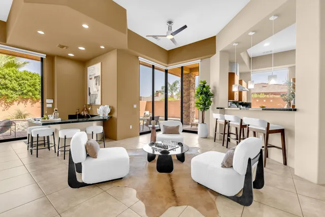 a dining room with furniture and window