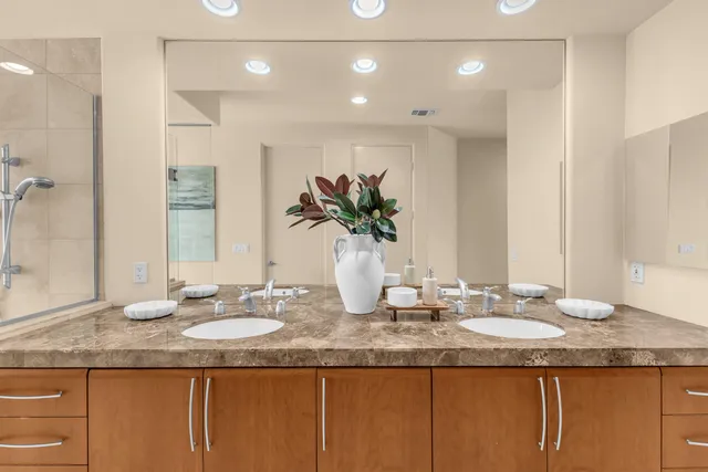 a bed room with a bed and a large window