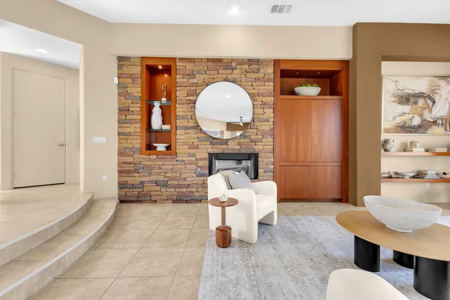 an aerial view of residential houses with city view