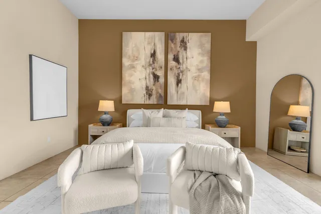 a living room with patio furniture and a large window