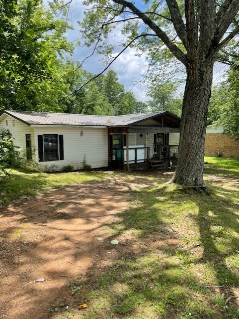 313 Simpson Street Lawrenceburg, TN 38464 - Photo 2 of 2 a view of a house with a yard