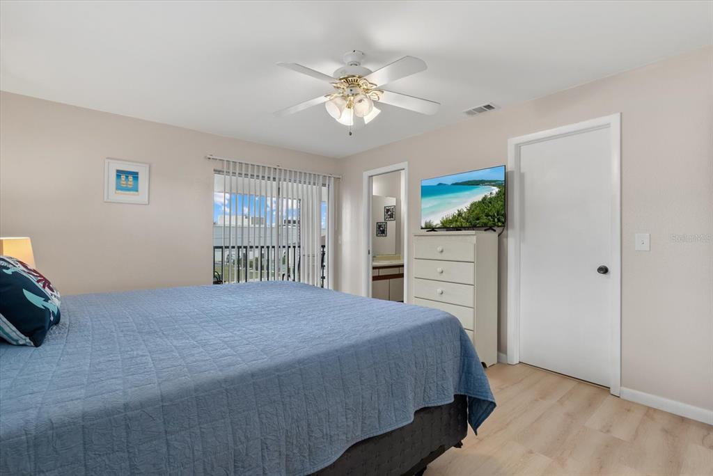 1531 Placida Road, Unit 204 Englewood, FL 34223 - Photo 18 of 47 a bedroom with a large bed and a window