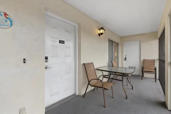a view of a livingroom with furniture and a window