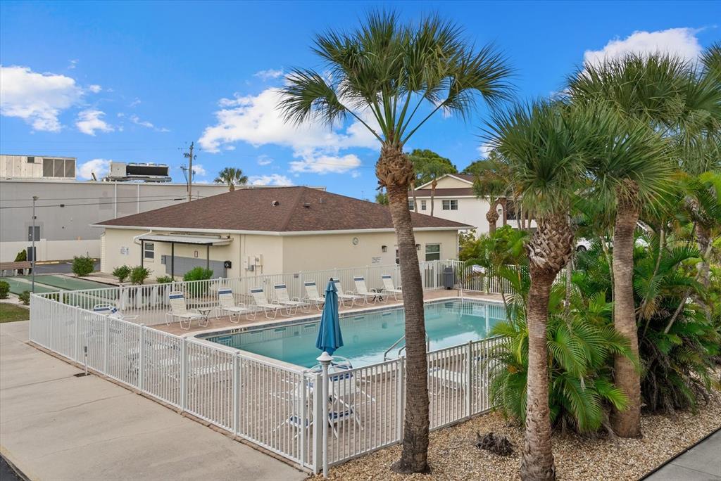1531 Placida Road, Unit 204 Englewood, FL 34223 - Photo 25 of 47 a front view of a house with swimming pool