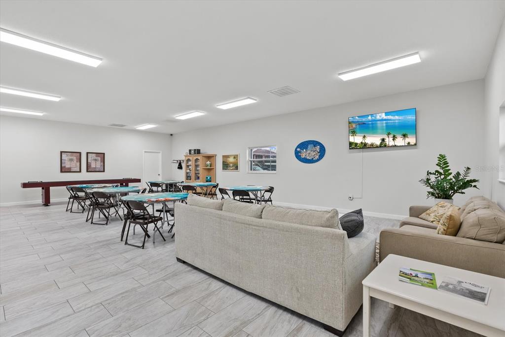 1531 Placida Road, Unit 204 Englewood, FL 34223 - Photo 32 of 47 a living room with furniture and wooden floor