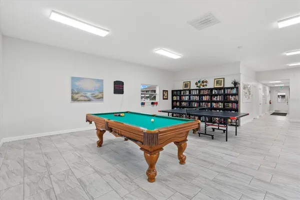 a room with furniture and a book shelf