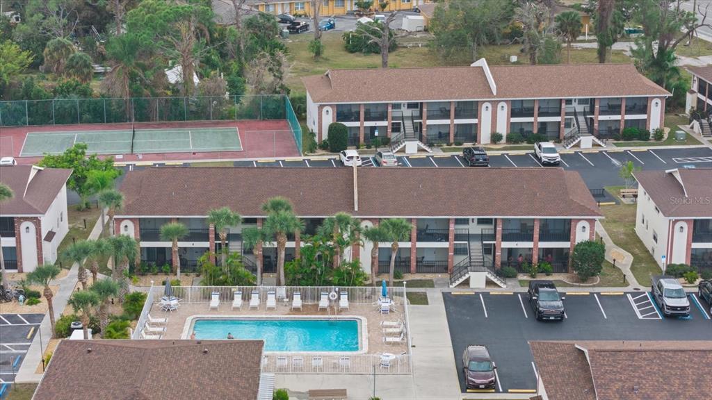 1531 Placida Road, Unit 204 Englewood, FL 34223 - Photo 39 of 47 an aerial view of a house with garden space and street view