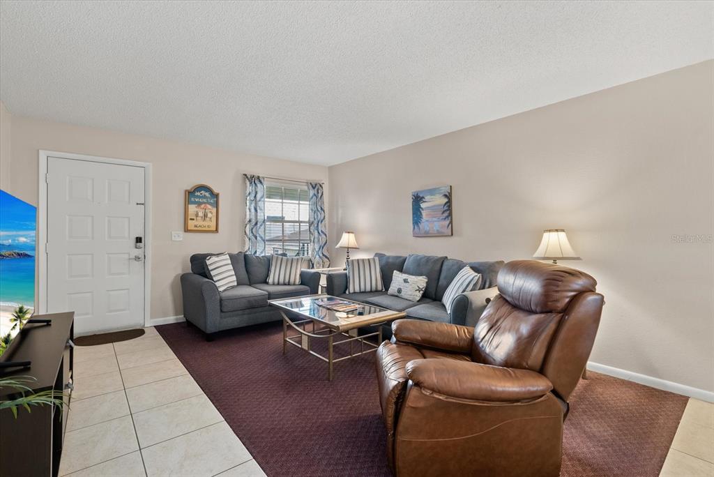 1531 Placida Road, Unit 204 Englewood, FL 34223 - Photo 4 of 47 a living room with furniture and a couch