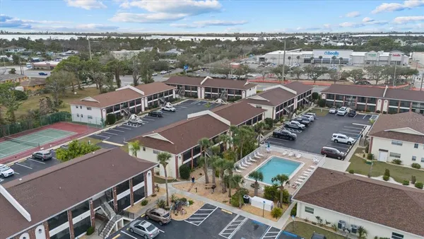 an aerial view of residential houses with outdoor space