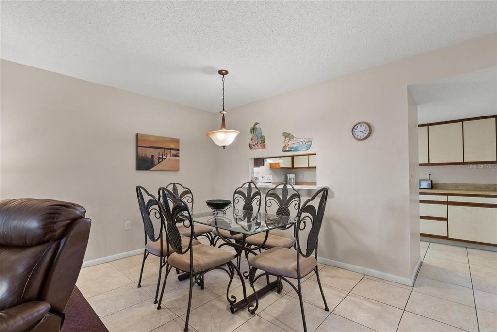 1531 Placida Road, Unit 204 Englewood, FL 34223 - Photo 7 of 47 a view of a dining room with furniture