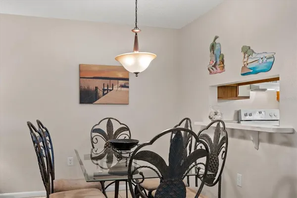 a view of a dining room with furniture and chandelier