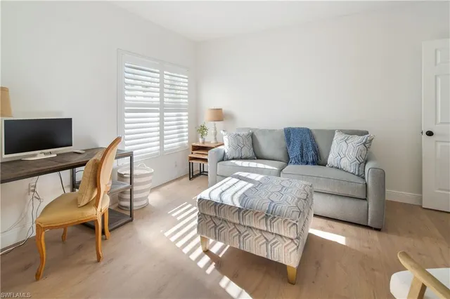 a spacious bedroom with a bed and a couch