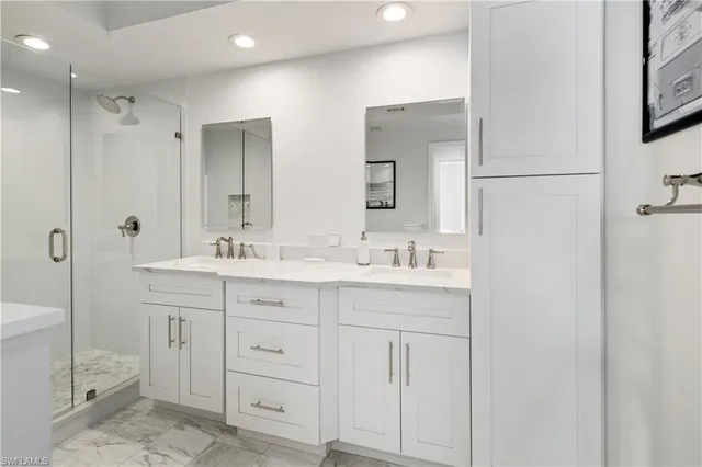 a bathroom with a double vanity sink mirror and double