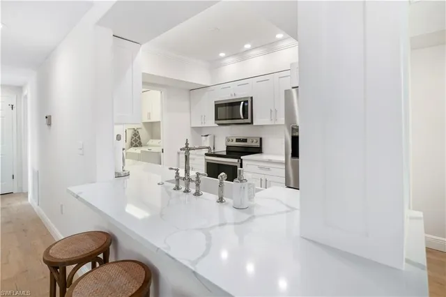 a dining room with furniture and a mirror
