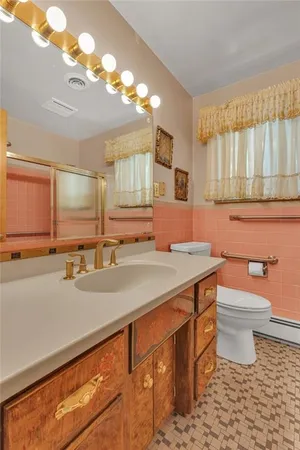 an empty room with a chandelier fan