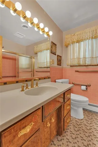 an empty room with a chandelier fan