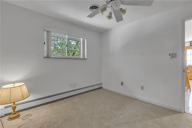 a view of a livingroom with a chandelier fan
