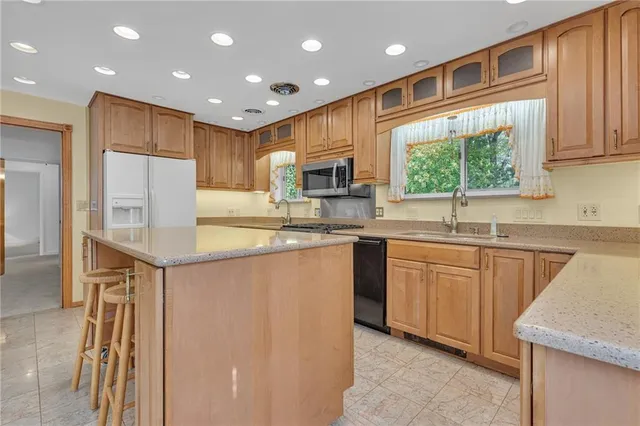 a kitchen with a sink stove and microwave