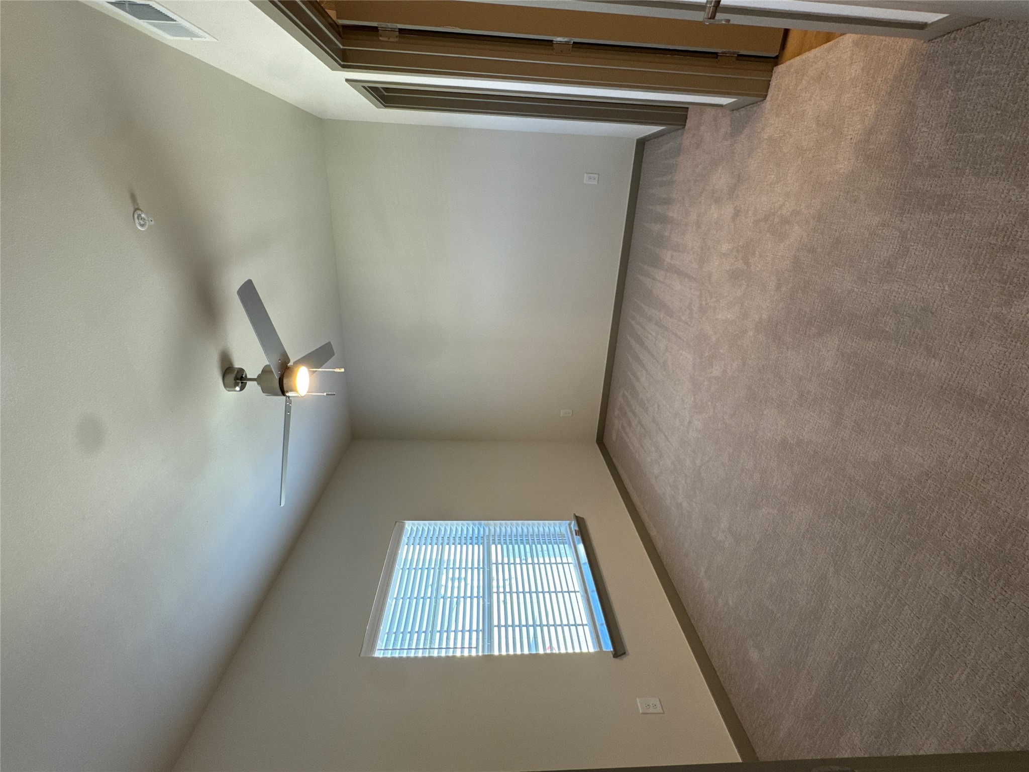 691 Union Chapel Road, Unit B2 Cedar Creek, TX 78612 - Photo 6 of 26 an empty room with windows and ceiling fan