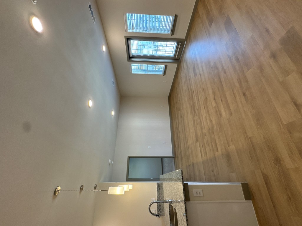 691 Union Chapel Road, Unit B2 Cedar Creek, TX 78612 - Photo 7 of 26 Living room with light wood-style floors and recessed lighting