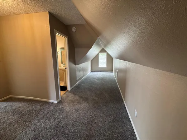 a bathroom with a shower and a glass door