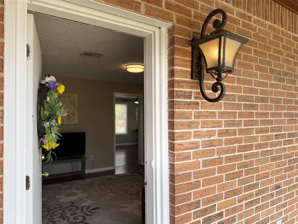 a living room with a flat screen tv and a fireplace