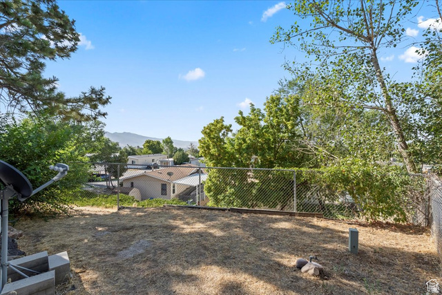 2875 North Hill Field Road, Unit 17 Layton, UT 84041 - Photo 20 of 23 View of yard with a mountain view