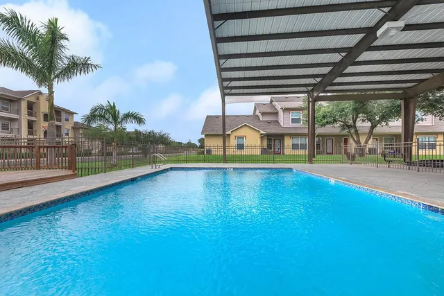 a view of swimming pool with seating space