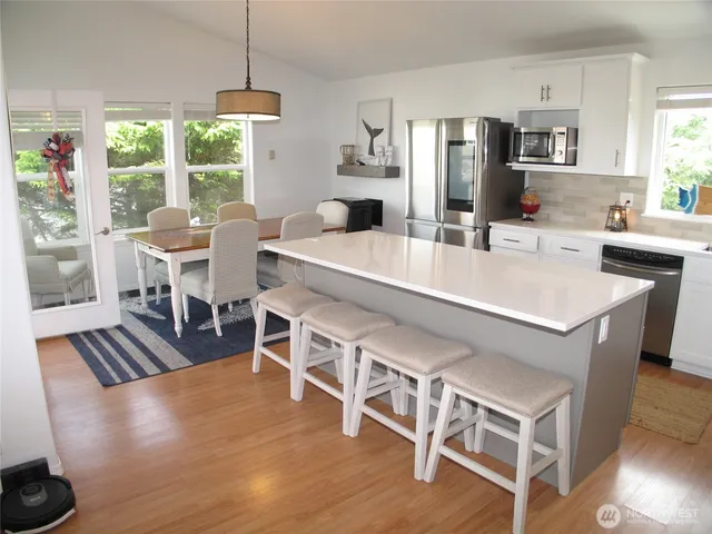 a view of a dining room with furniture and window