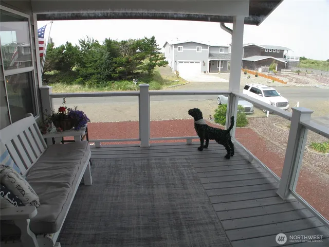 a front view of a house with outdoor seating