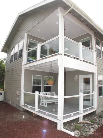 a white bench sitting in front of a building