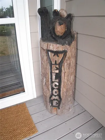 a front view of a house with plants