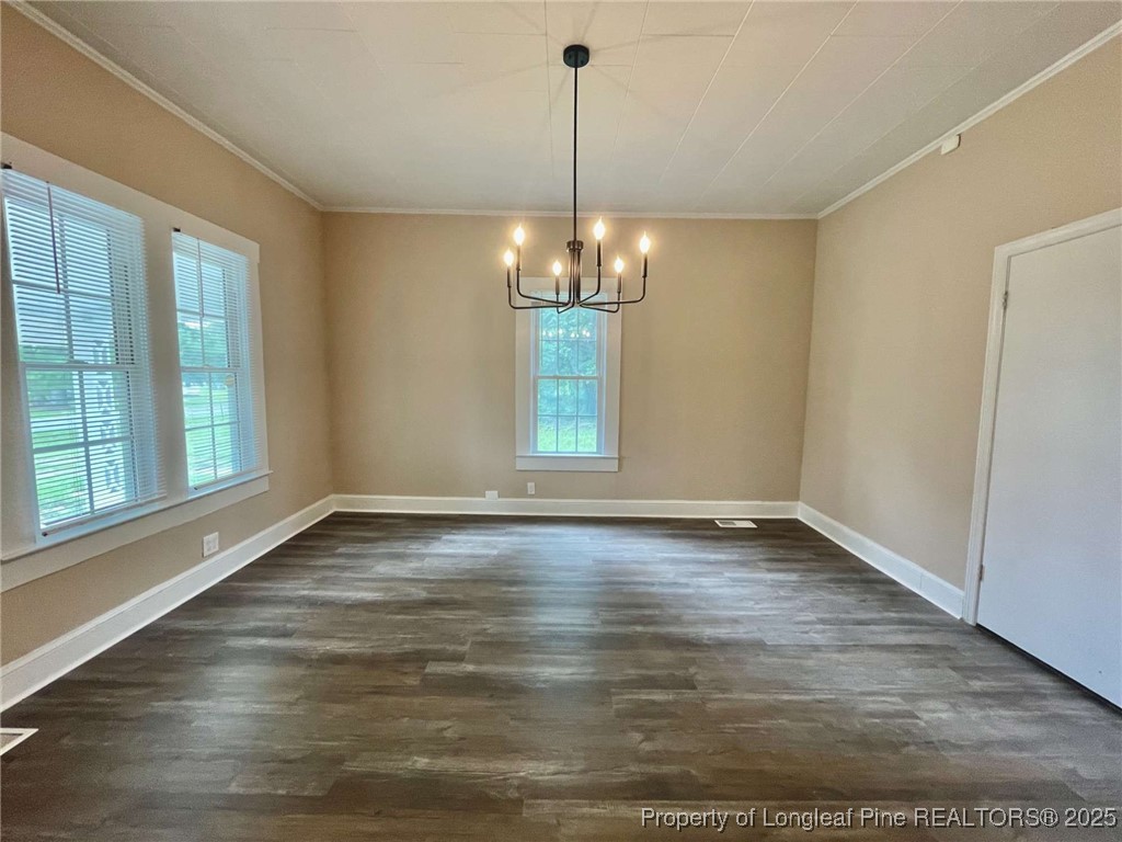 416 Old Maxton Road Raeford, NC 28376 - Photo 3 of 26 a view of an empty room with window and wooden floor