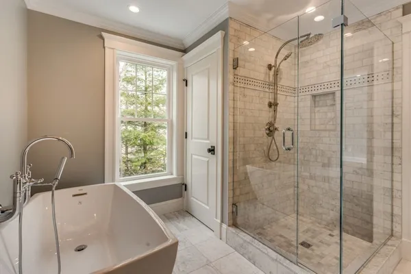 a bathroom with a shower and a sink